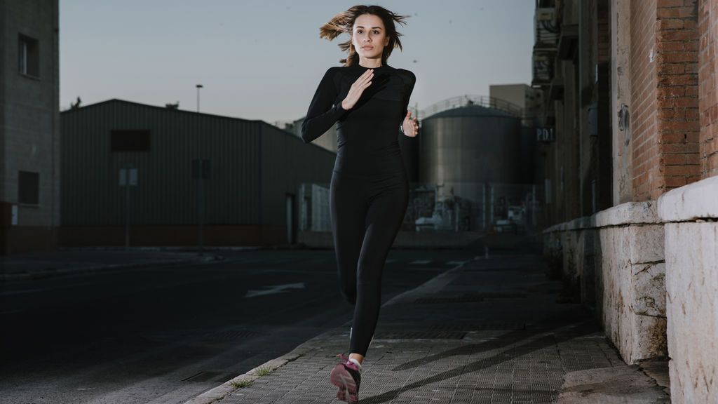 serious-woman-running-with-determination-on-street