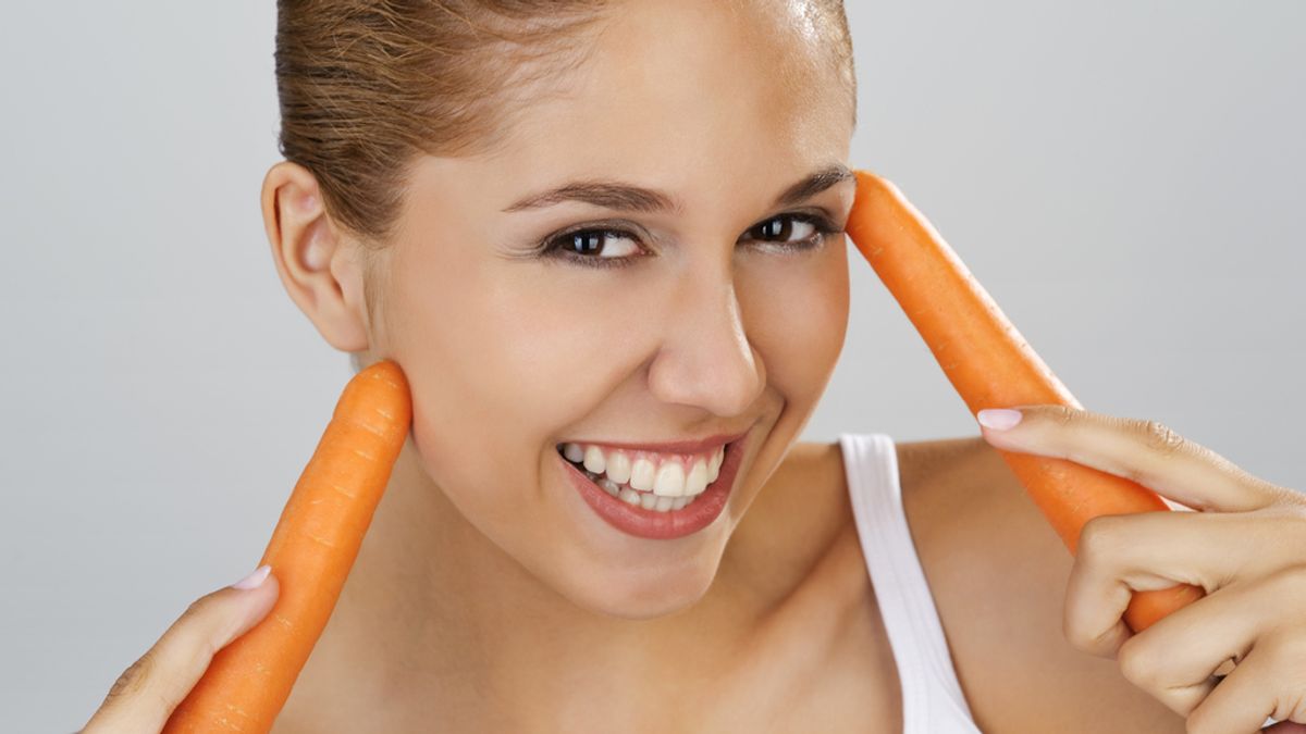 Mujer con zanahorias