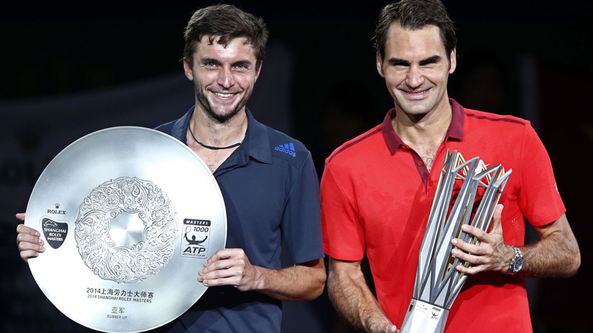 Federer y Gilles Simon posan con sus trofeos