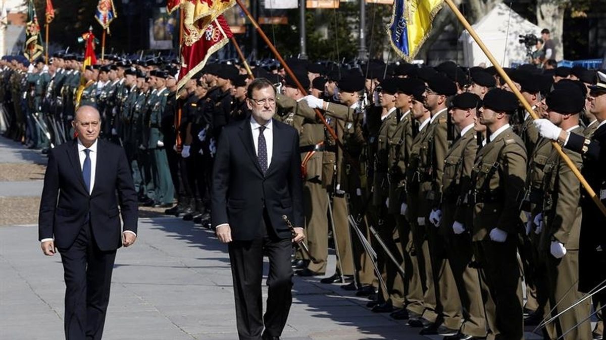 El presidente del Gobierno, Mariano Rajoy, y el ministro del Interior, Jorge Fernández