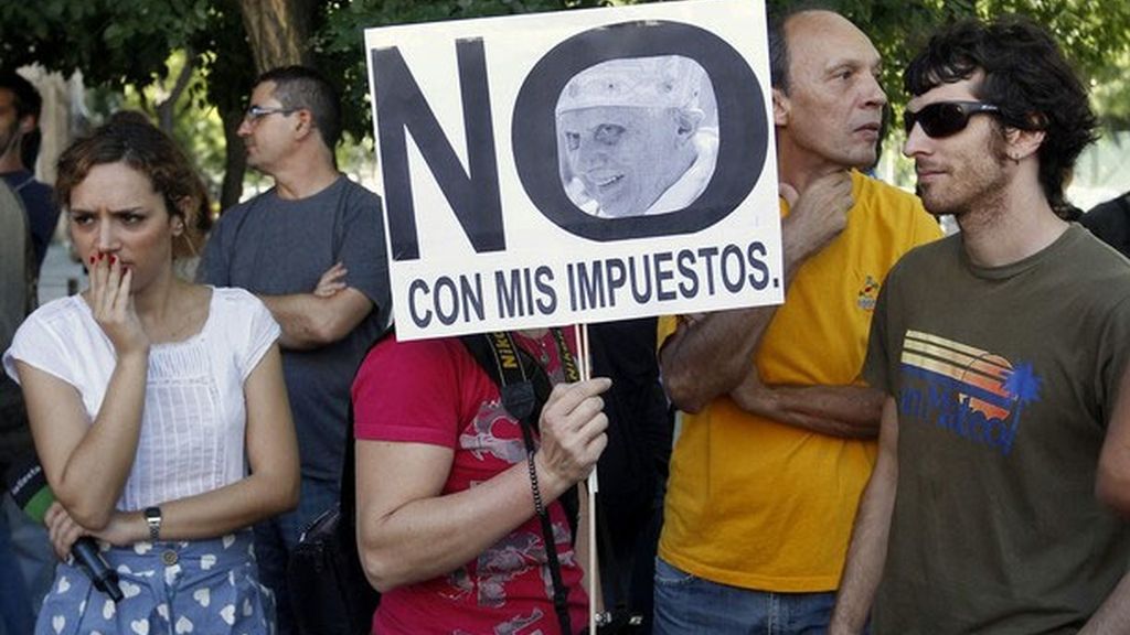 Manifestantes contrarios a las rebajas al transporte de los peregrinos del JMJ