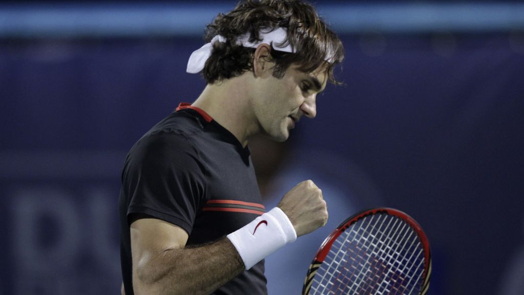 El tenista suizo Roger Federer celebra un tanto ante el español Feliciano López durante la segunda ronda del Torneo de Dubai El tenista suizo Roger Federer celebra un tanto ante el español Feliciano López durante la segunda ronda del Torneo de Dubai