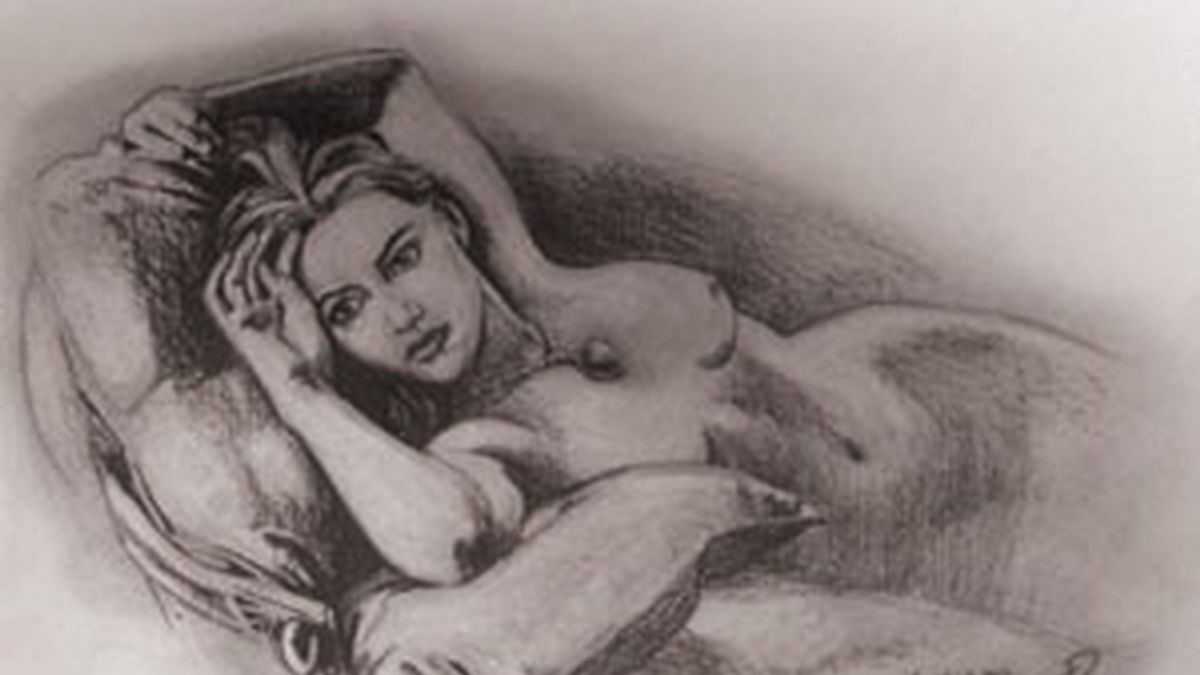 La actriz Kate Winslet posando desnuda en un sofá llevando únicamente un collar en la película Titanic. Foto: Premiere Props