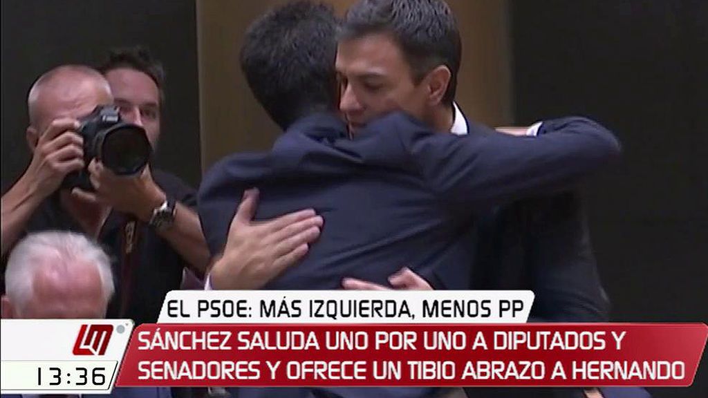 El tibio abrazo de Sánchez y Hernando