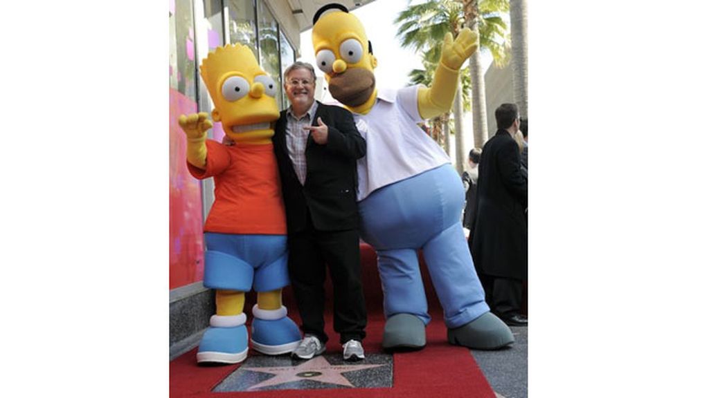 Homer y Bart, junto a sus 'voces' -Hank Azaria, Yeardley Smith y Nancy Cartwright-, acompañan al dibujante