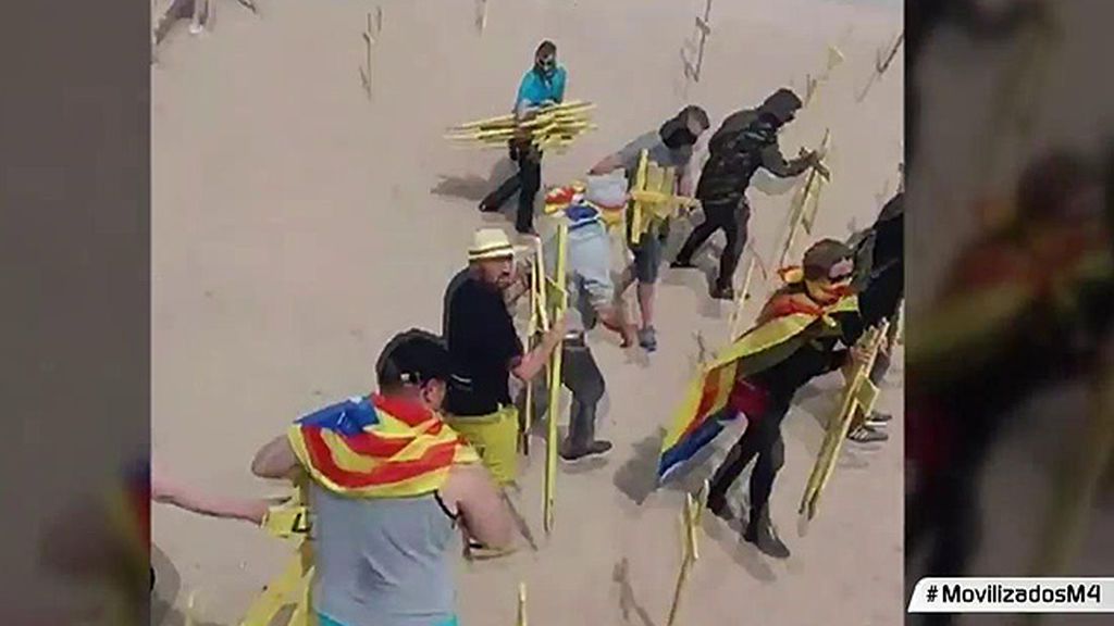 Discusión en la playa de Cataluña donde se habían colocado cruces amarillas