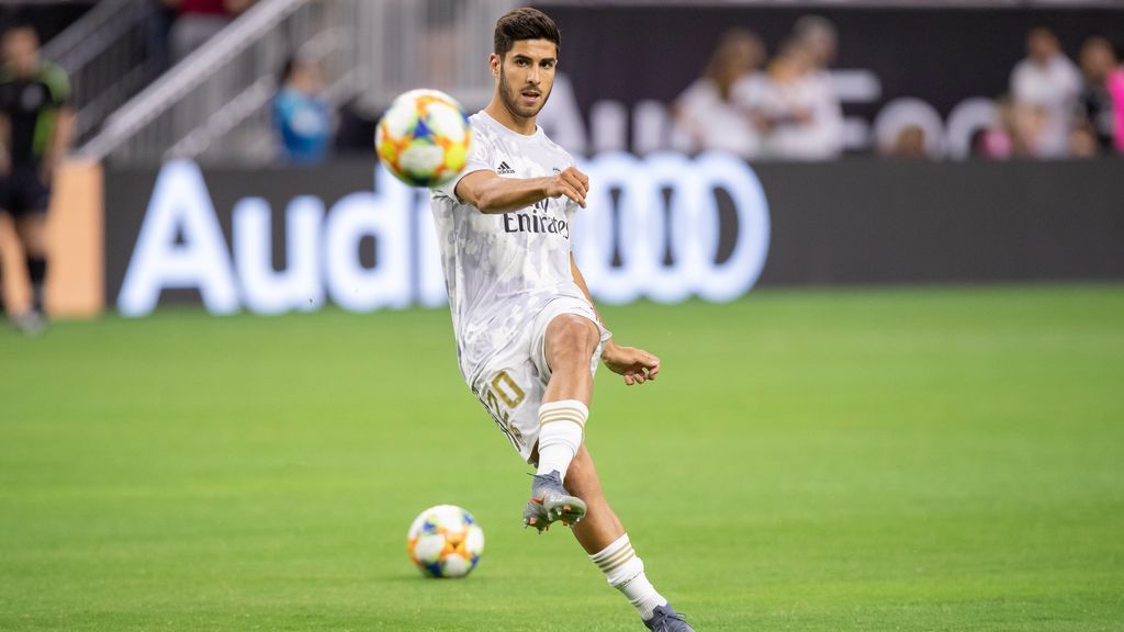 Marco Asensio, en un partido con el Madrid antes de la lesión.