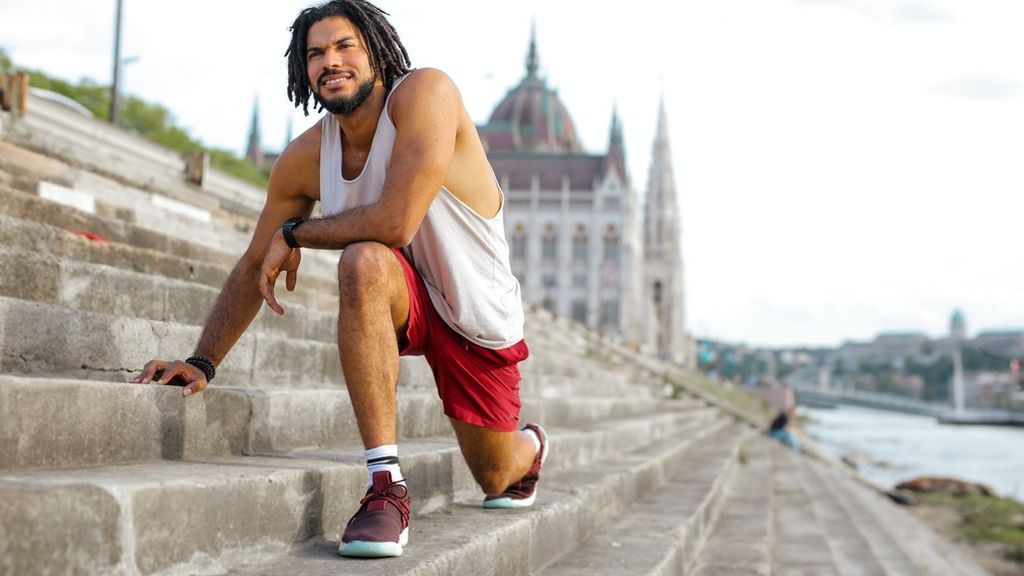 man-stretching-on-concrete-stairs-3766202