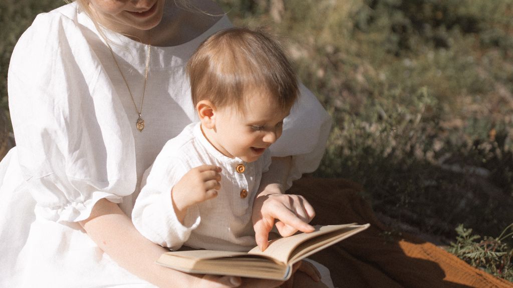 photo-of-woman-and-baby-reading-a-book-4513218