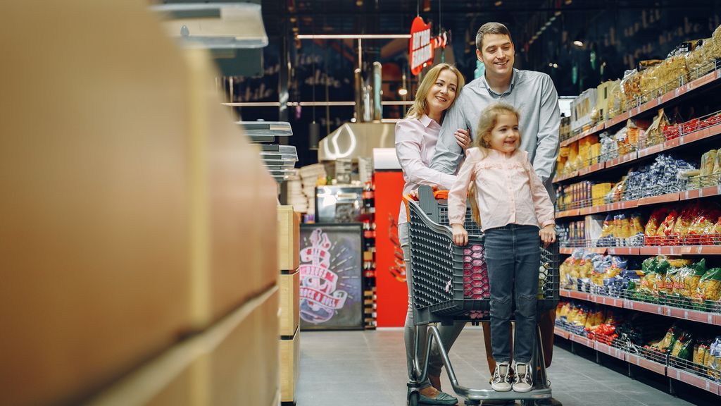 girls-standing-on-shopping-cart-3985065