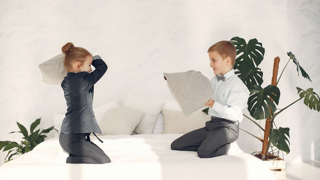 happy-little-business-kids-having-fun-together-during-game-3874421