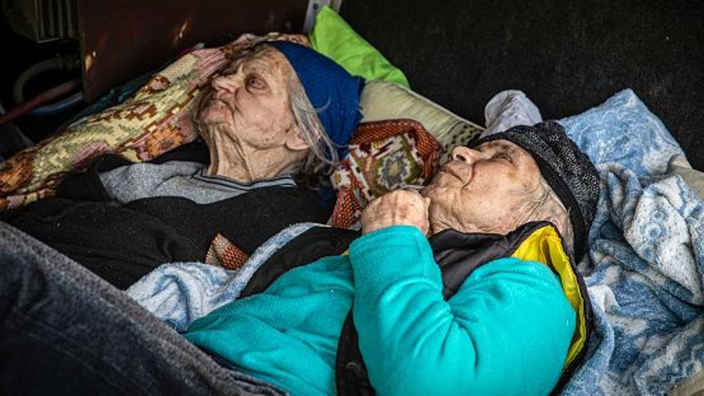 BAKHMUT, UKRAINE - 2022/05/23: Two elderly people who can't walk are in a luggage space on an evacuation bus. Donetsk (Donbas) region is under heavy attack during the full Russian invasion of Ukraine. Russia invaded Ukraine starting on February 24, killing numerous civilians and soldiers. (Photo by Alex Chan Tsz Yuk/SOPA Images/LightRocket via Getty Images)