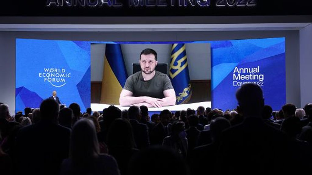 Volodymyr Zelenskiy, Ukraine's president, receives a standing ovation as he delivers a special address via video link on the opening day of the World Economic Forum (WEF) in Davos, Switzerland, on Monday, May 23, 2022. The annual Davos gathering of political leaders, top executives and celebrities runs from May 22 to 26. Photographer: Hollie Adams/Bloomberg via Getty Images