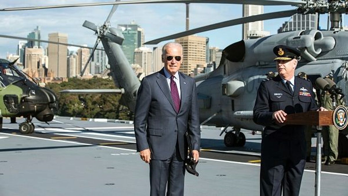 US Vice President Joe Biden (L) is introduced to Australian Defence Force personnel by Air Chief Marshal Mark Binkin, Chief of the Defence Forces (R), on board HMAS Adelaide at the Garden Island Naval Base in Sydney on July 19, 2016.
Biden is visiting Australia on a four day trip which includes visits to Melbourne and Sydney. / AFP / POOL / Jessica Hromas (Photo credit should read JESSICA HROMAS/AFP via Getty Images) US Vice President Joe Biden (L) is introduced to Australian Defence Force personnel by Air Chief Marshal Mark Binkin, Chief of the Defence Forces (R), on board HMAS Adelaide at the Garden Island Naval Base in Sydney on July 19, 2016.
Biden is visiting Australia on a four day trip which includes visits to Melbourne and Sydney. / AFP / POOL / Jessica Hromas (Photo credit should read JESSICA HROMAS/AFP via Getty Images)