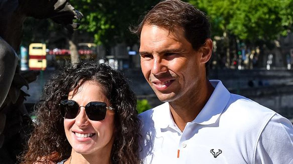Rafael NADAL of Spain poses with his wife Xisca PERELLO after a photoshoot for his 14th victory at Roland Garros on June 6, 2022 at Alexandre III bridge in Paris, France. (Photo by Baptiste Fernandez/Icon Sport via Getty Images)