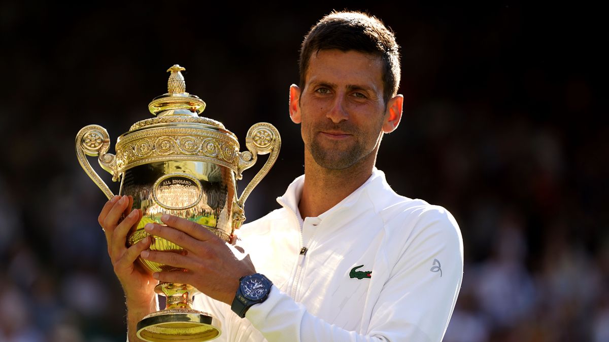 Novak Djokovic of Serbia celebrates with the trophy after the final of the 2022 Wimbledon Championships, Grand Slam tennis tournament on July 10, 2022 at All England Lawn Tennis Club in Wimbledon near London, England - Photo Andrew Cowie / Colorsport / DPPI