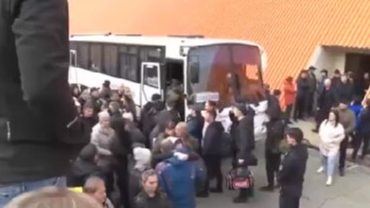 Russian first reservists say goodbye to their families as queues grow to flee the country