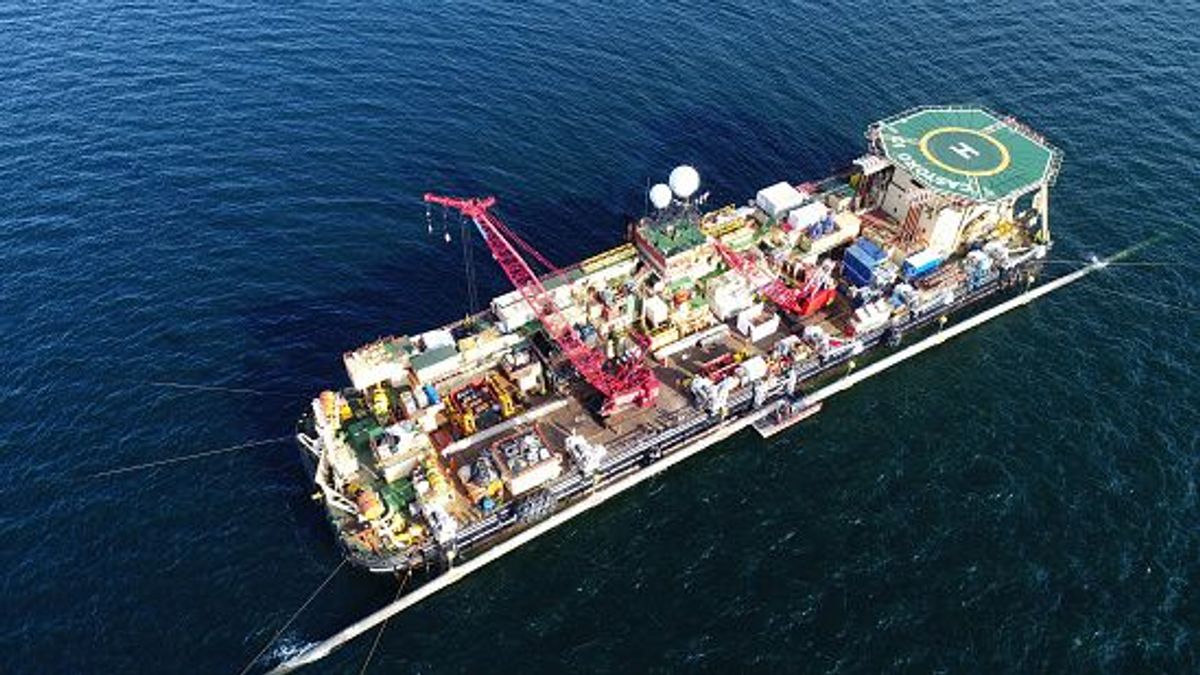 12 August 2019, Mecklenburg-Western Pomerania, Sassnitz: On a platform at the pipeline laying ship "Castoro 10" off the southeast tip of the island of R?gen, experts are working on the connection of two pipeline sections of the Baltic Sea natural gas pipeline Nord Stream 2 (aerial photograph with a drone). The new double line will be laid essentially parallel to the Nord Stream 1 Baltic Sea pipeline, through which gas has been flowing from Russia to Lubmin near Greifswald since 2011. According to the plans, the new pipeline, which will also be 1200 kilometers long, will be ready for operation by the end of the year. Photo: Stefan Sauer/dpa-Zentralbild/dpa (Photo by Stefan Sauer/picture alliance via Getty Images)