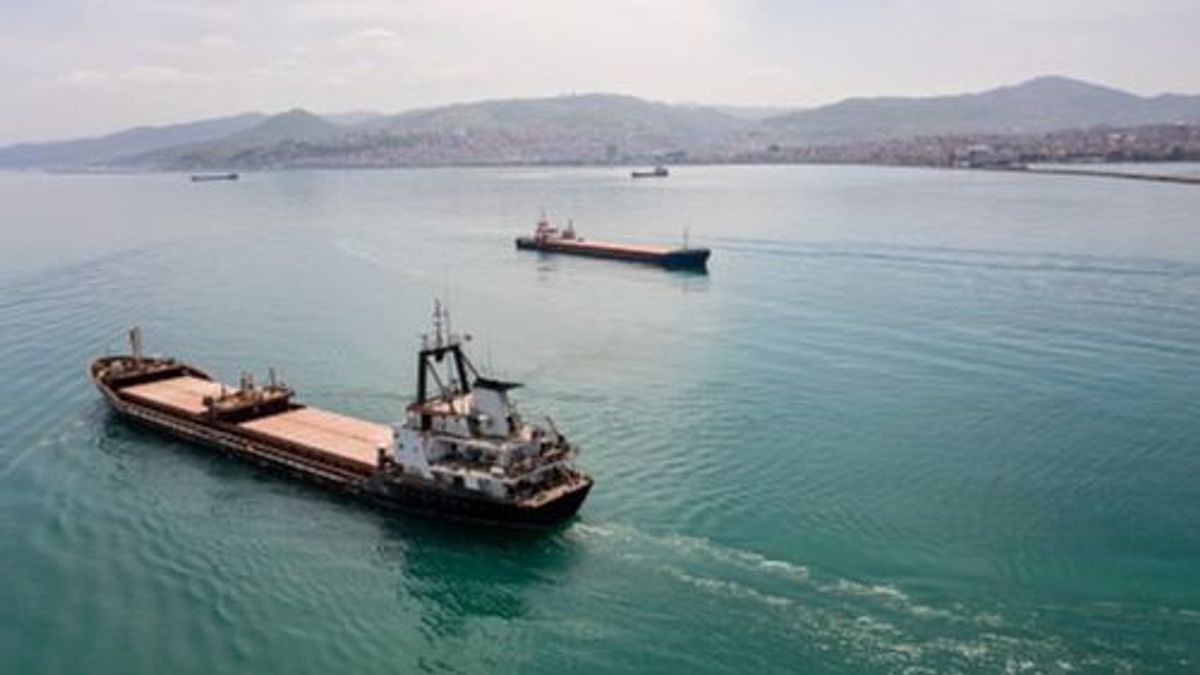 Aerial view of cargo ship in transit. Aerial view of cargo ship in transit.