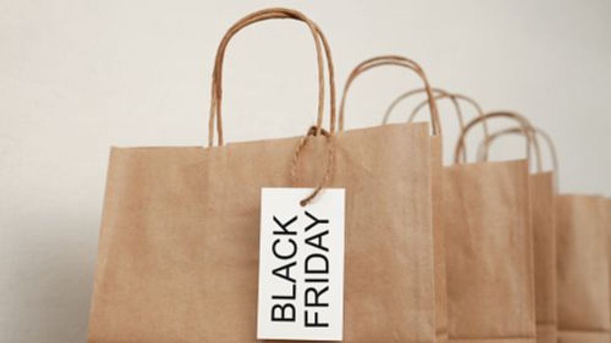 Paper shopping bags with white tags. Concept of sale and Black Friday.