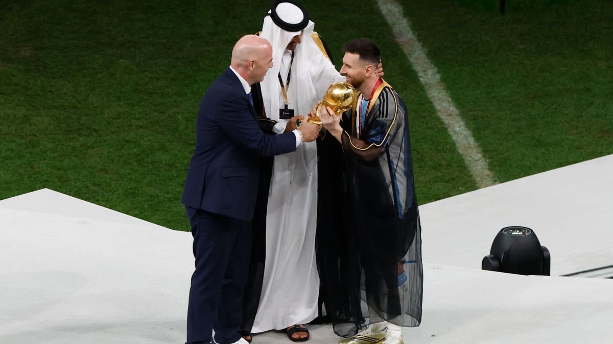 FIFA President Gianni Infantino, Emir of Qatar Sheikh Tamim bin Hamad Al Thani and Lionel Messi of Argentina holding the World Cup during the trophy ceremony following the FIFA World Cup 2022, Final football match between Argentina and France on December 18, 2022 at Lusail Stadium in Al Daayen, Qatar - Photo Jean Catuffe / DPPI
