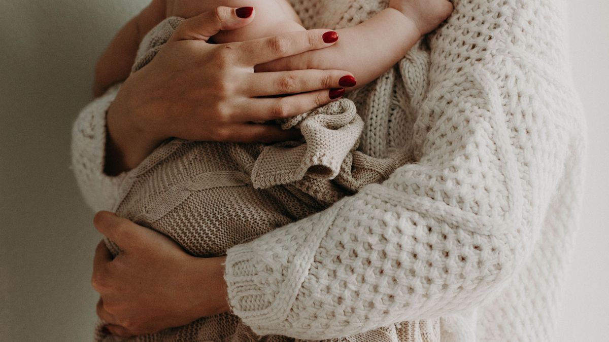 Una madre con su bebé Una madre con su bebé