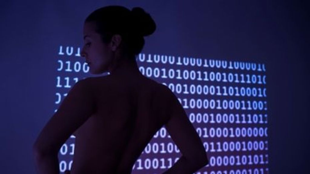 MODEL RELEASED. Woman with binary code.