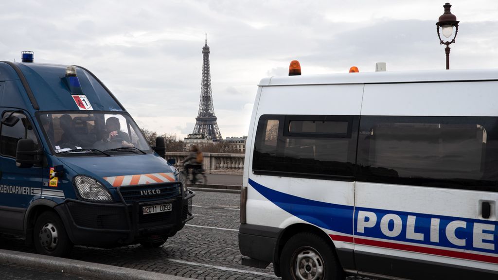 Police and Gendarmerie vans parked in front of the Eiffel Tower. For several days Paris has been engulfed in demonstrations and riots over President Emmanuel Macron's law to raise the retirement age. Trash containers and cars set on fire, broken shop windows and clashes with the police are a daily occurrence.