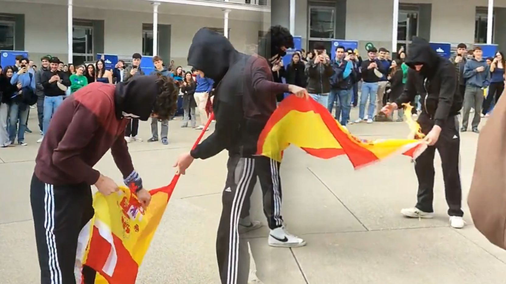 Dos jóvenes independentistas rompen e intentan quemar la bandera de España en una universidad de Cataluña mientras el resto les aplaude