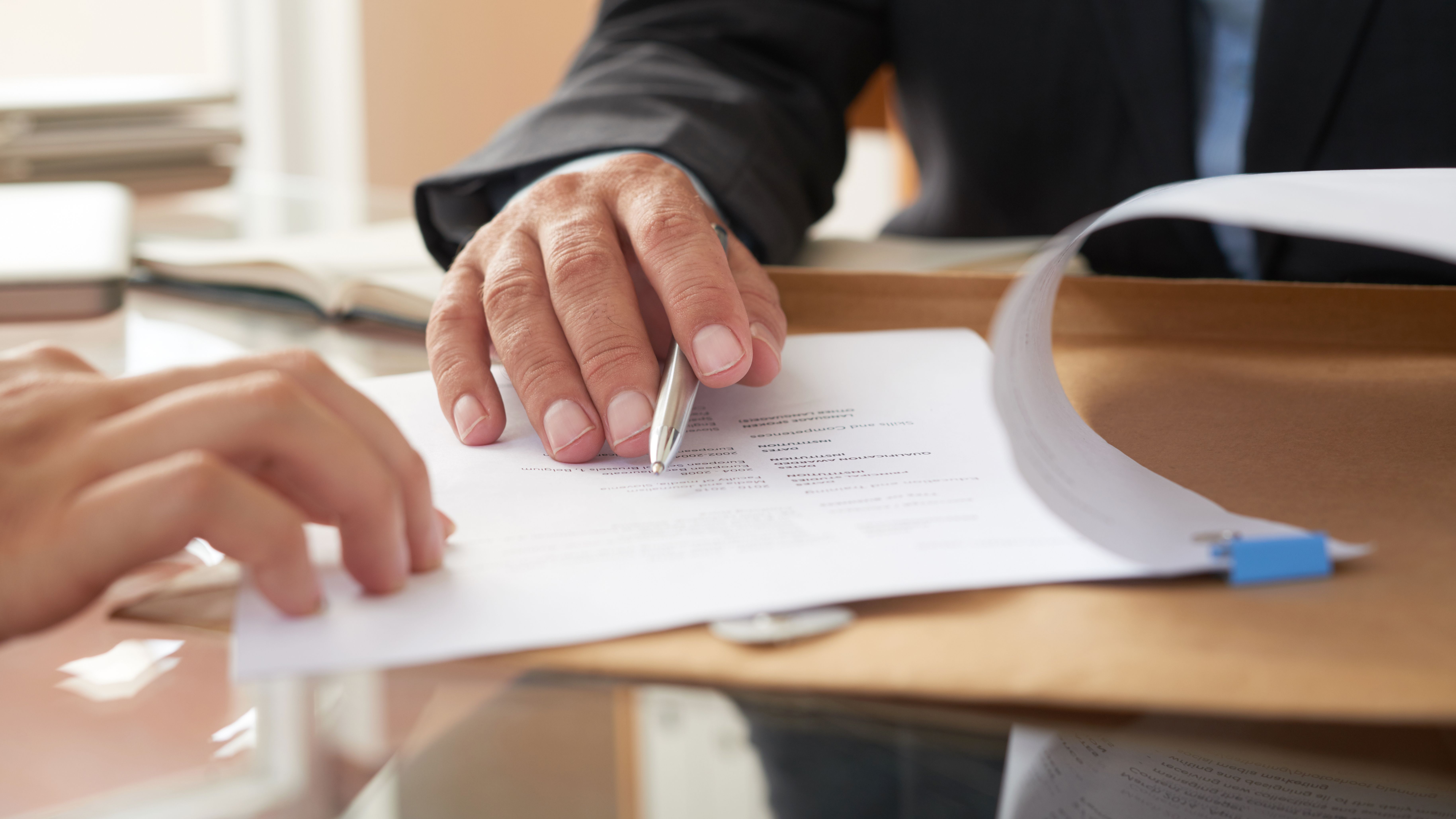Business people signing a contract Business people signing a contract