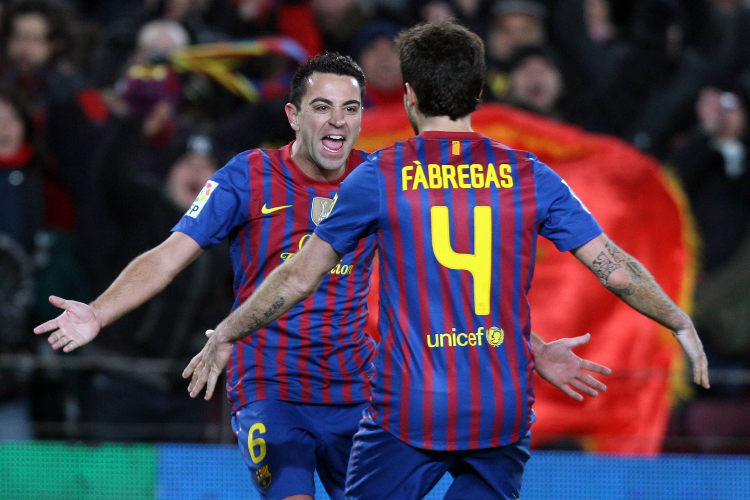  Cesc Fábregas y Xavi Hernández en el Barcelona.