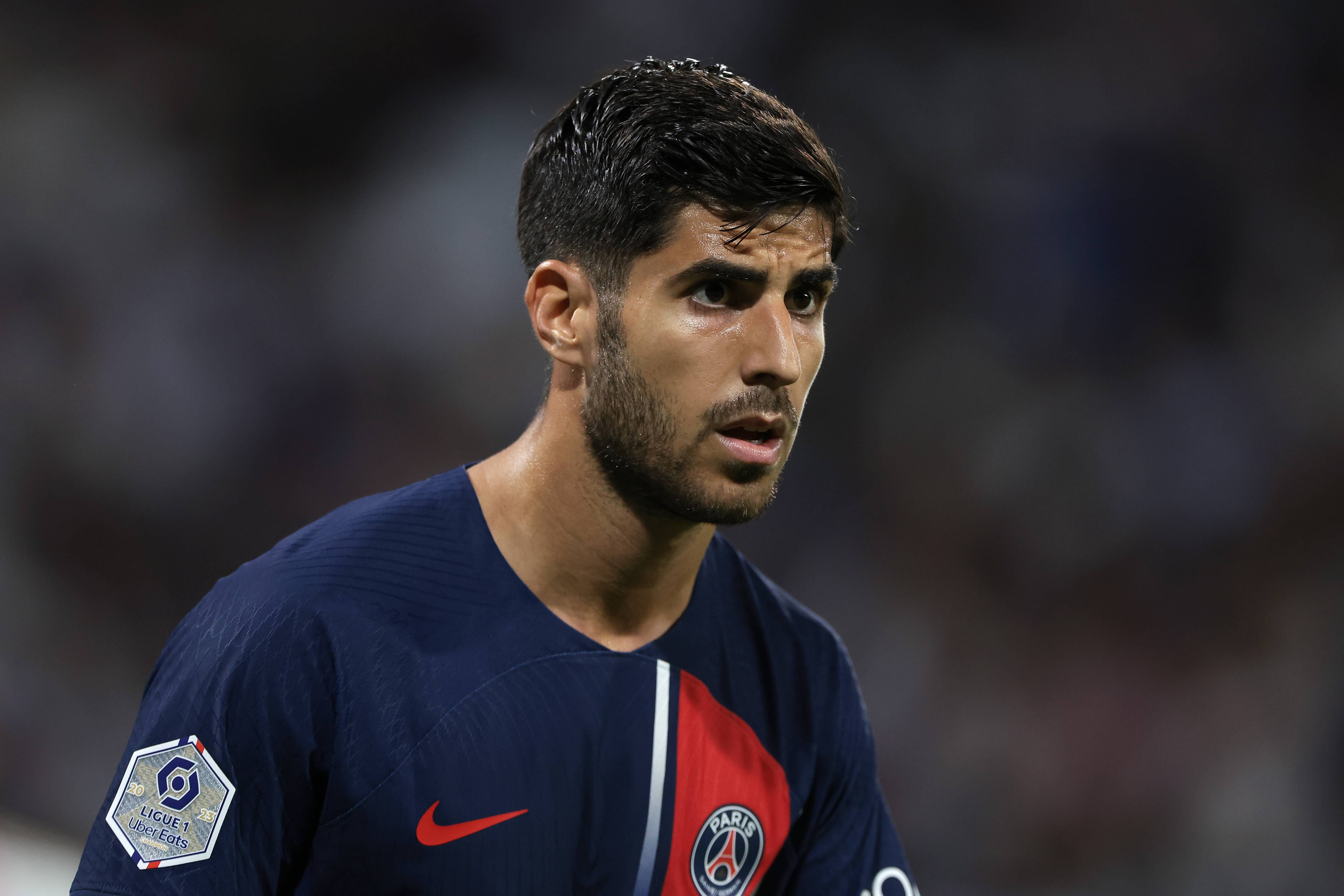  Marco Asensio, disputando un encuentro con el PSG..