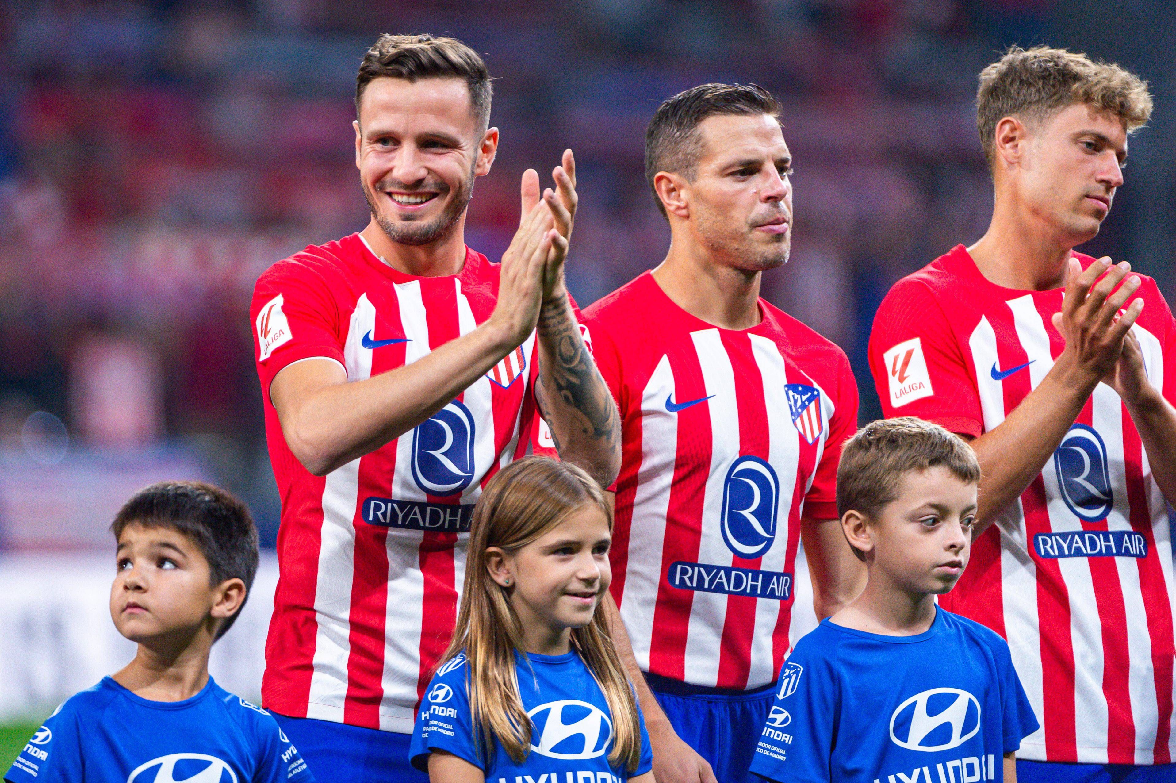 Saúl Ñíguez, Azpilicueta y Marcos Llorente, en un partido del Atlético.