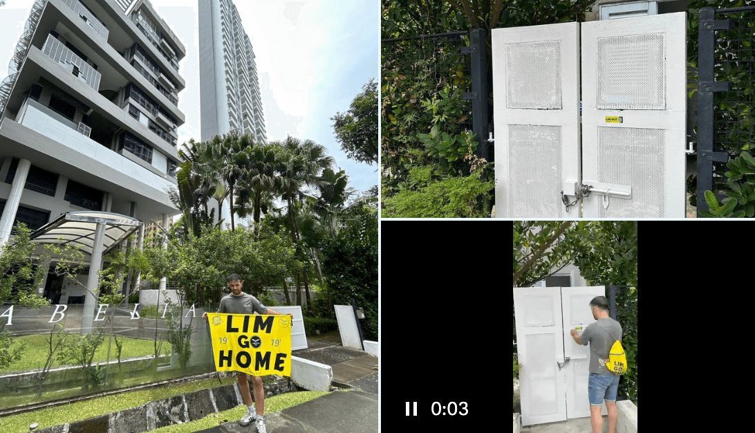 Aficionado poniendo una pegatina en una propiedad de Peter Lim