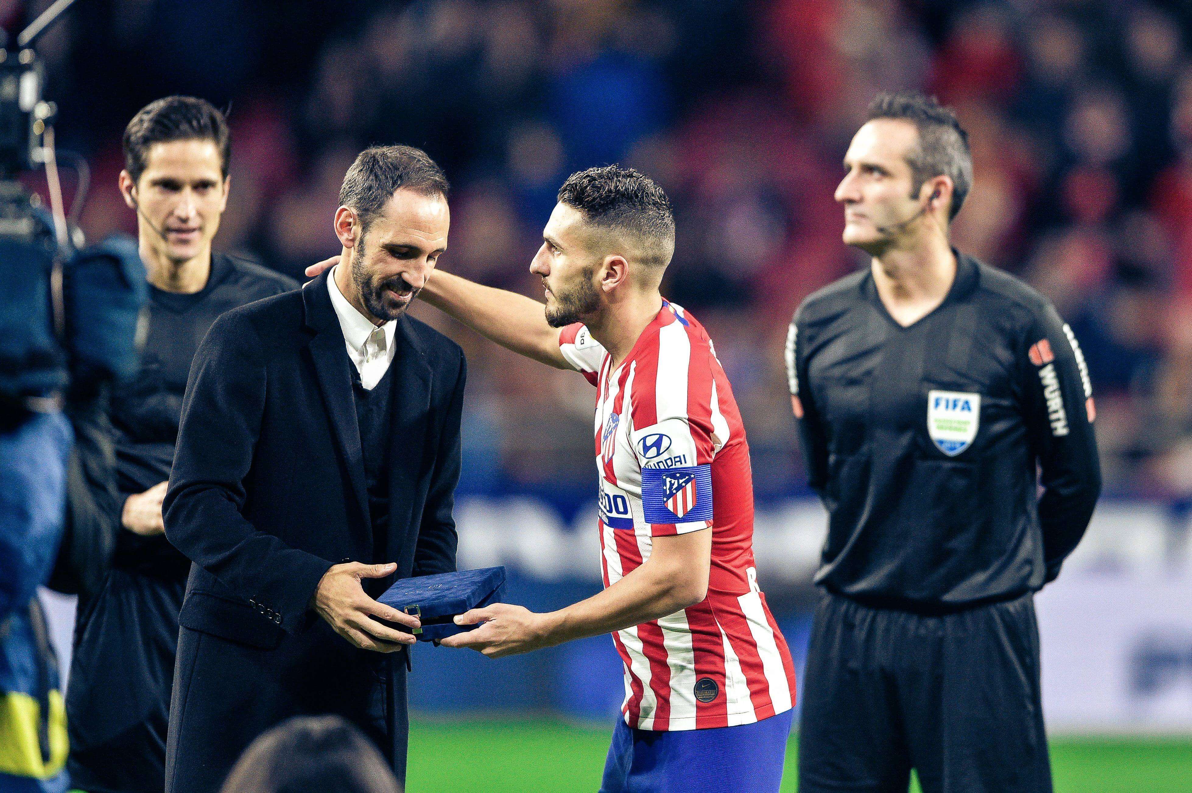  Juanfran Torres con Koke (Cordon Press)
