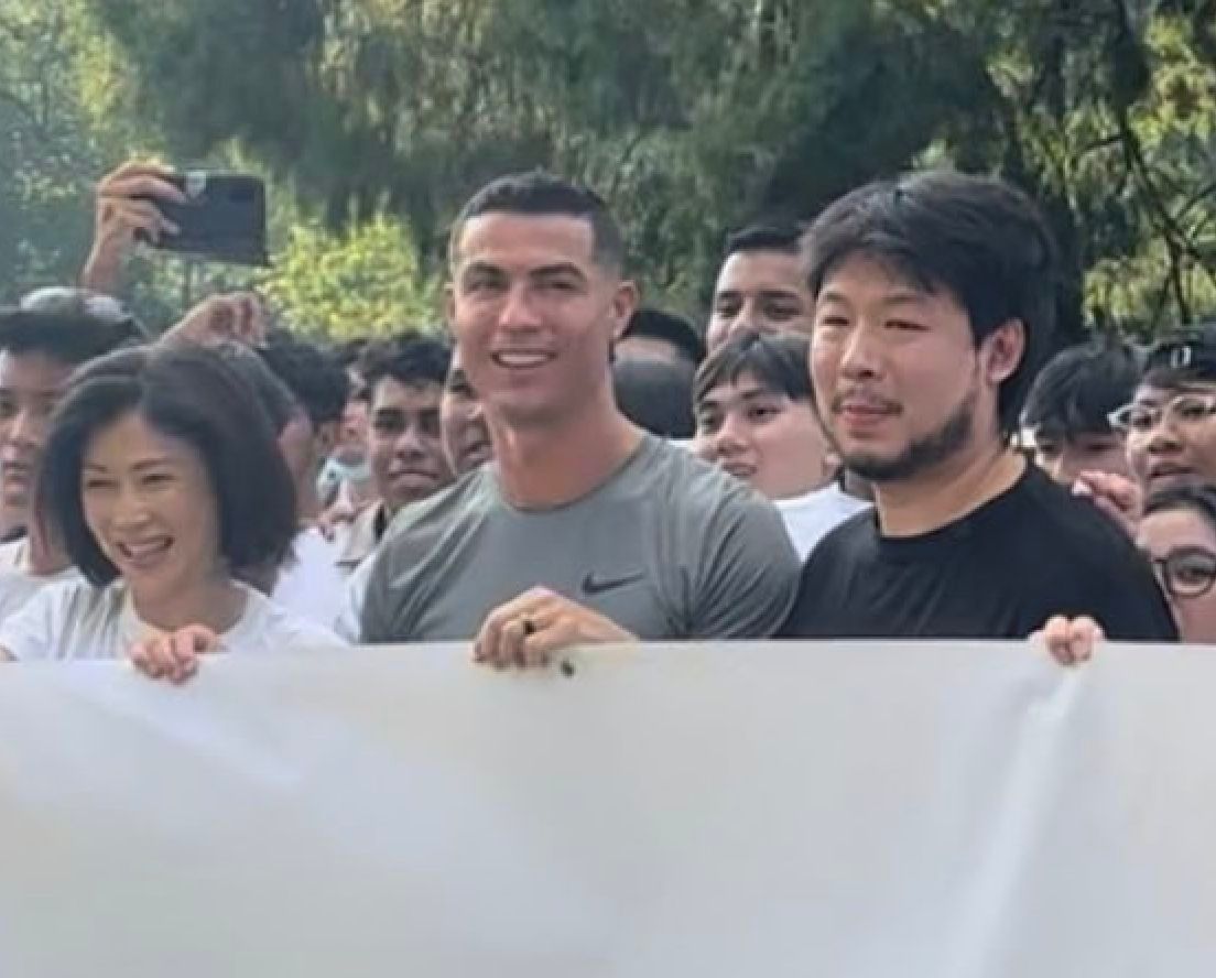 Kiat Lim junto a Cristiano Ronaldo