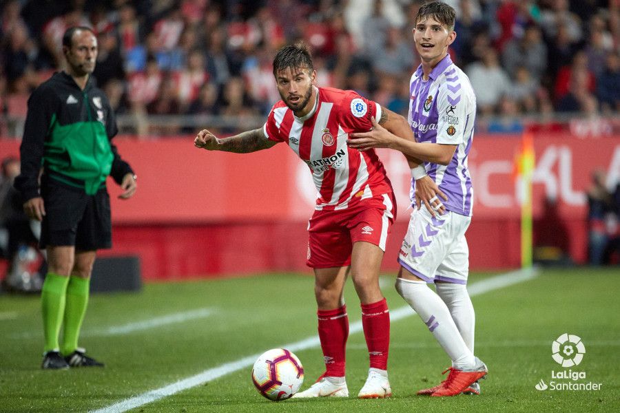 Toni Villa, junto a Cristian Portu.