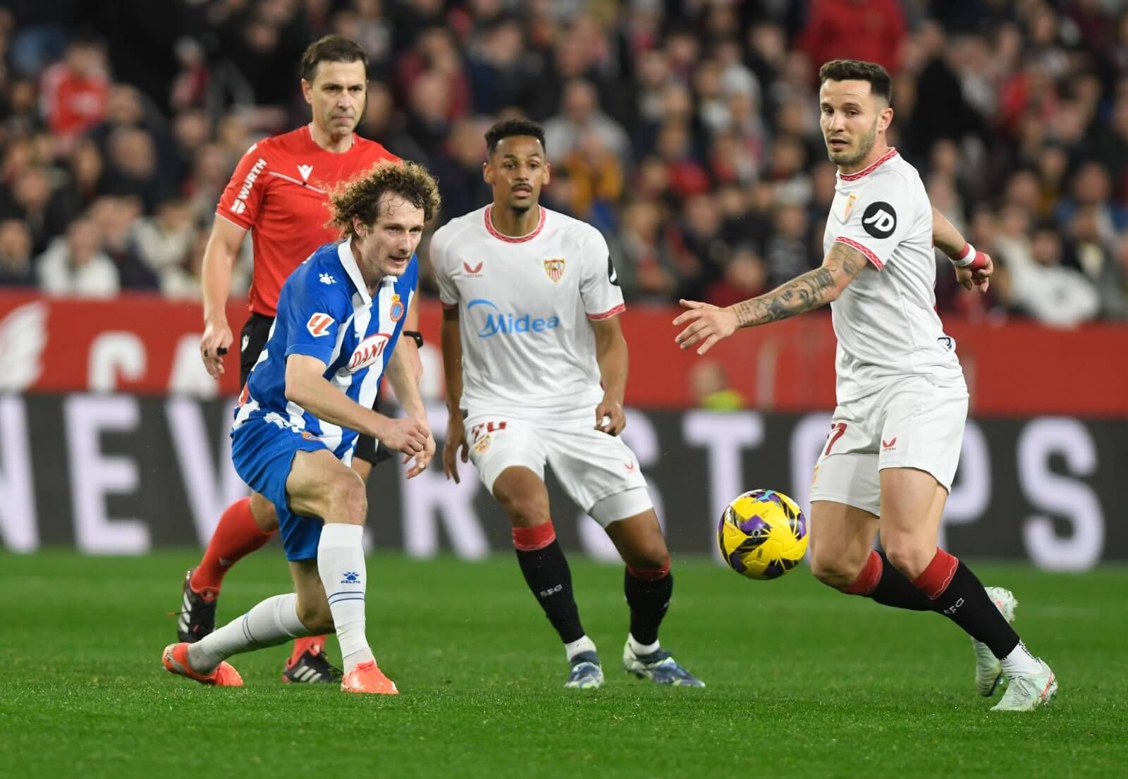 Saúl Ñíguez, Sow y Kral, en el Sevilla-Espanyol.
