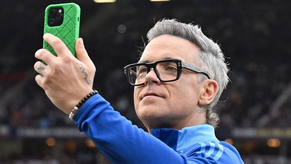 Robbie Williams durante un concierto reciente