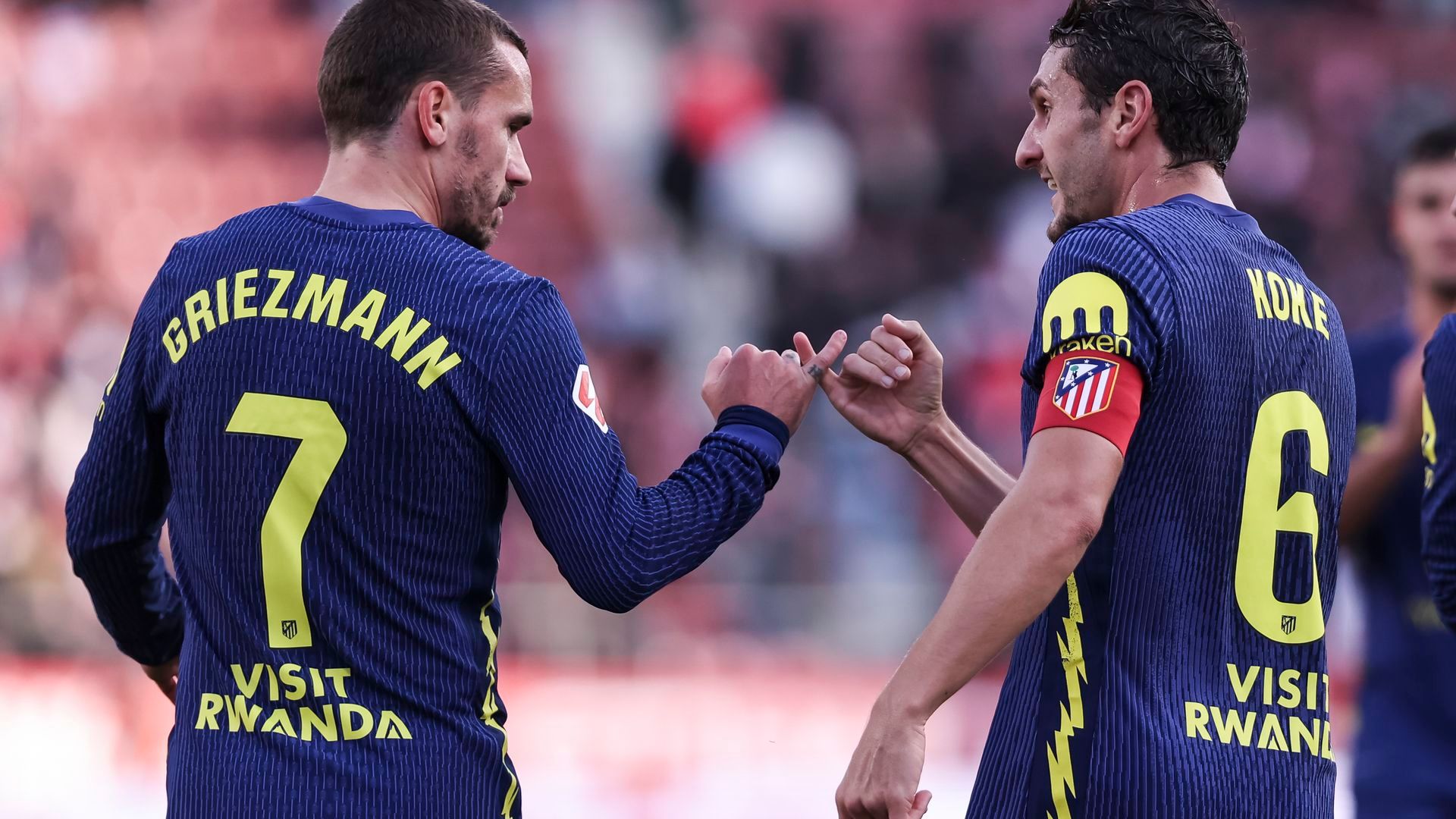 Koke y Griezmann celebrando un gol en Girona