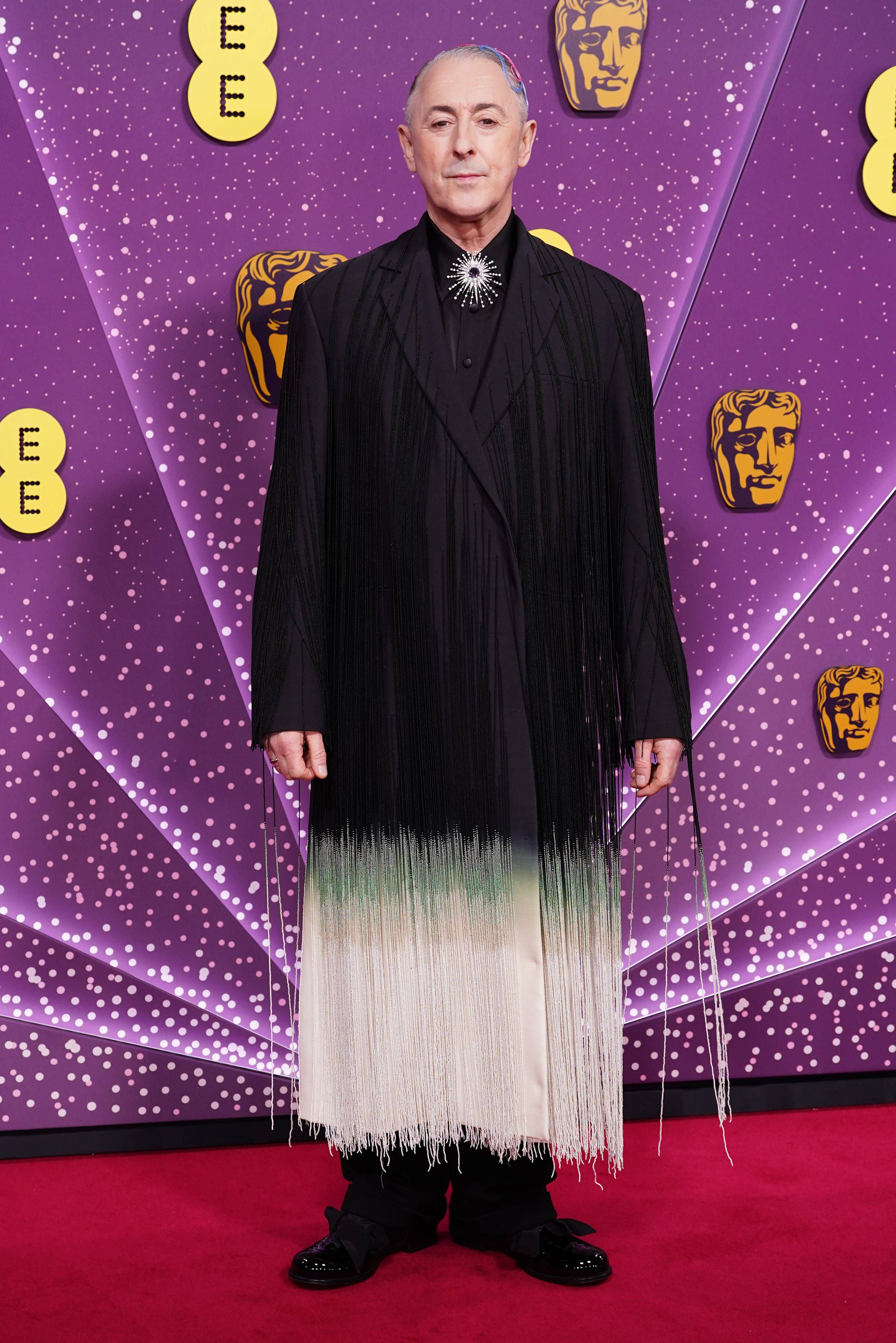 Alan Cumming en la alfombra roja de los Bafta 2026