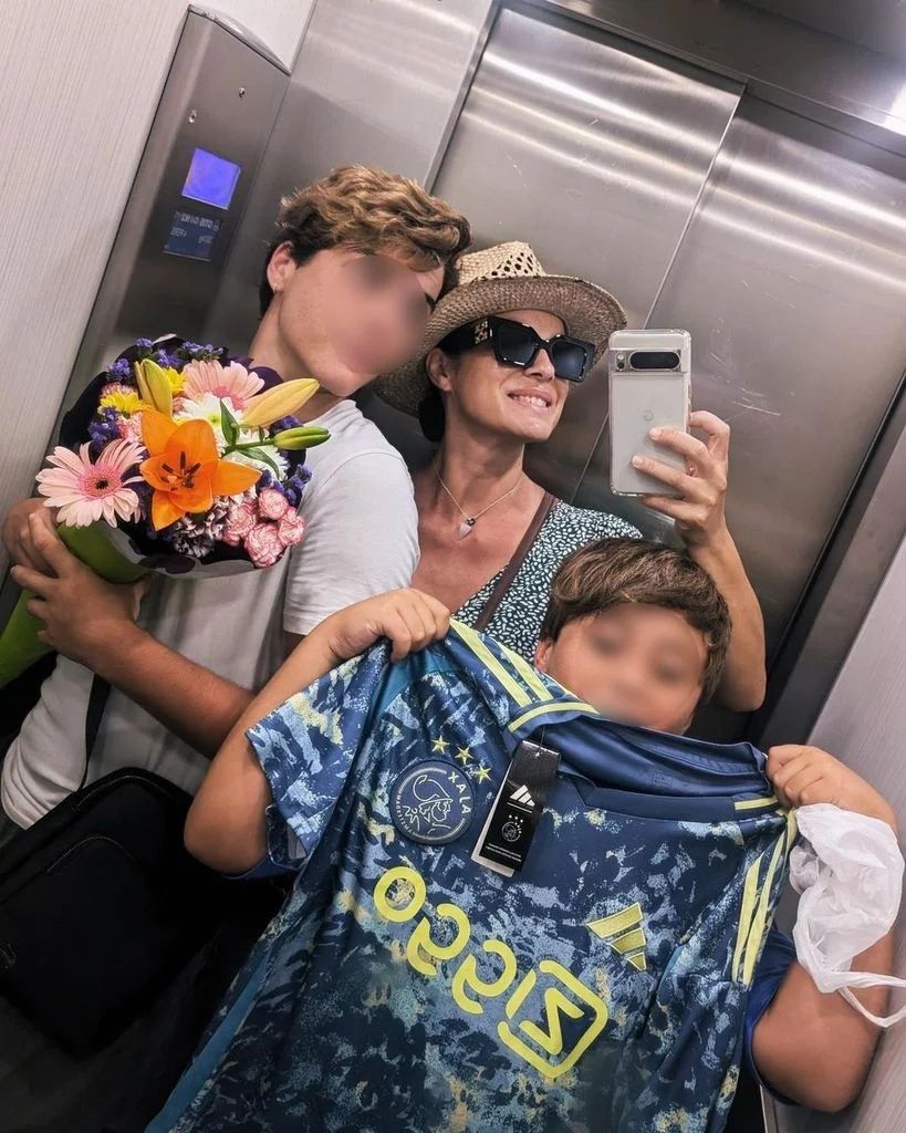 Geno Machado en una foto de archivo con sus dos hijos: Marco y Lucca Santos