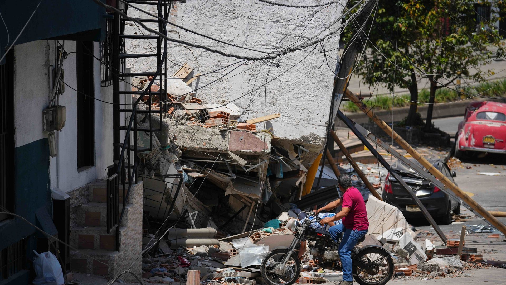 PEREIRA, Aug. 15, 2026  -- A man checks the damage of a building after an earthquake in Pereira, Colombia on Aug. 14, 2026.   A 7.4-magnitude earthquake jolted western Colombia on Monday.,Image: 1123323497, License: Rights-managed, Restrictions: , Model R