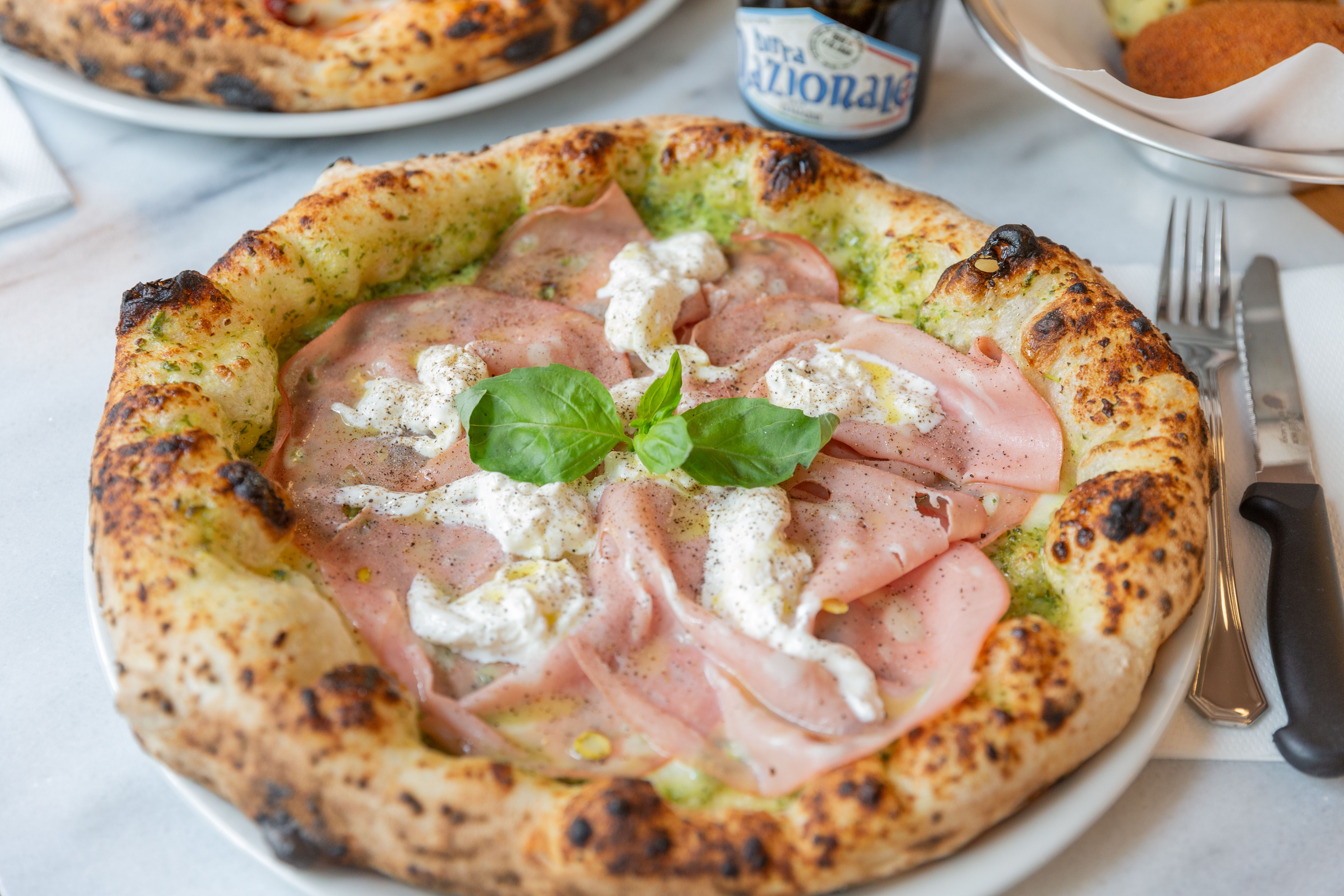 Su pizza de mortadela tampoco te la puedes perder